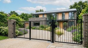 Professionally powder-coated metal gates and railings outside a modern home during summer
